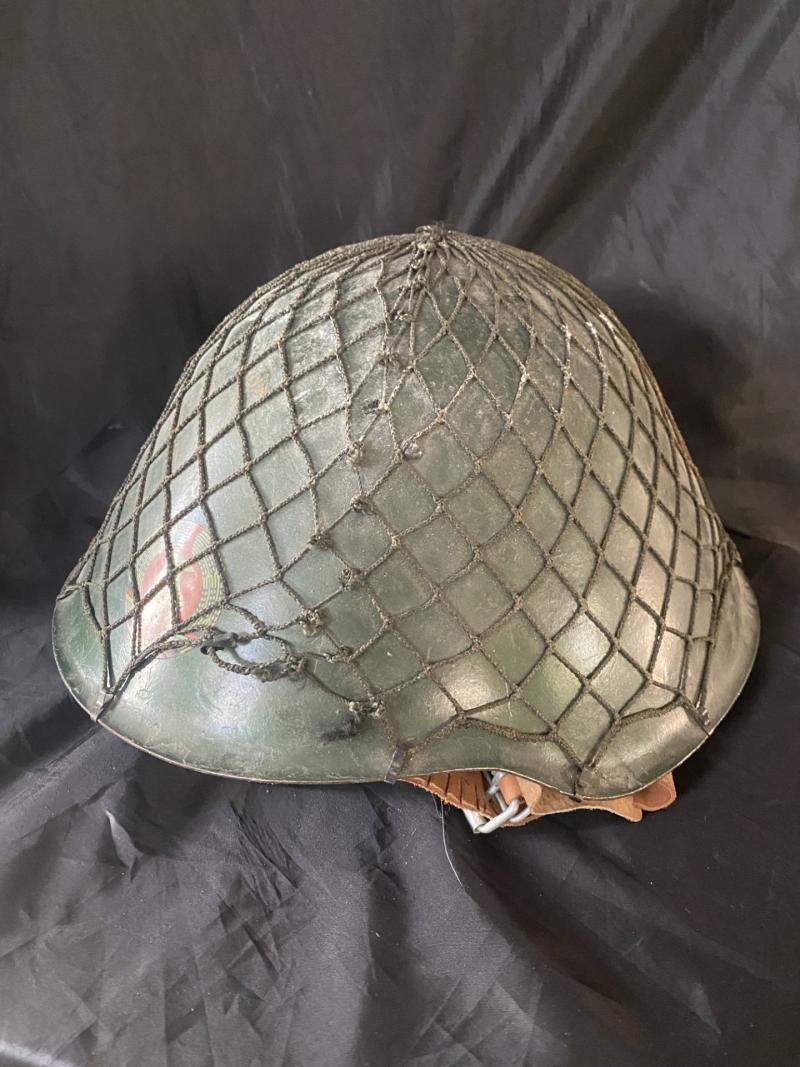 GERMAN DDR M56 HELMET WITH CAMO NETTING AND DDR EMBLEM