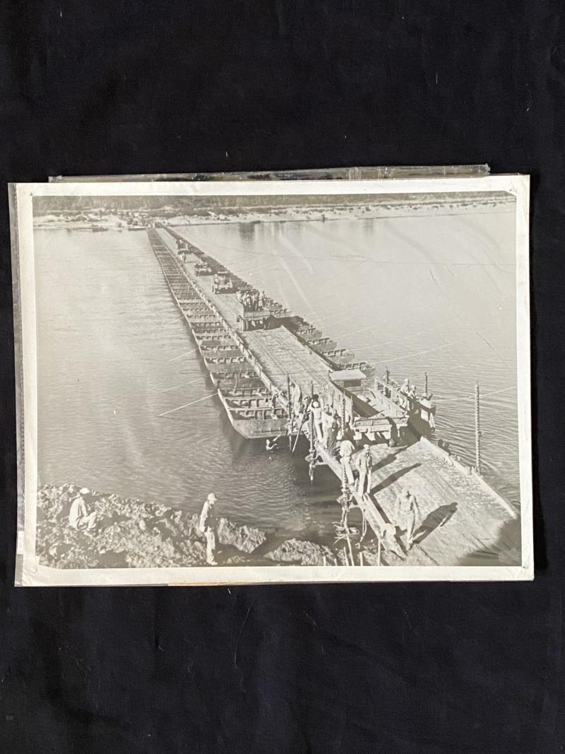 PHOTO OF A TRUCK CONVOY STARTS CROSSING THE AMERICAN BUILT PONTOON BRIDGE IN BURMA